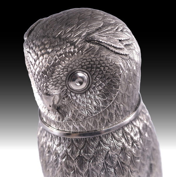A silver drinking vessel in the shape of an owl